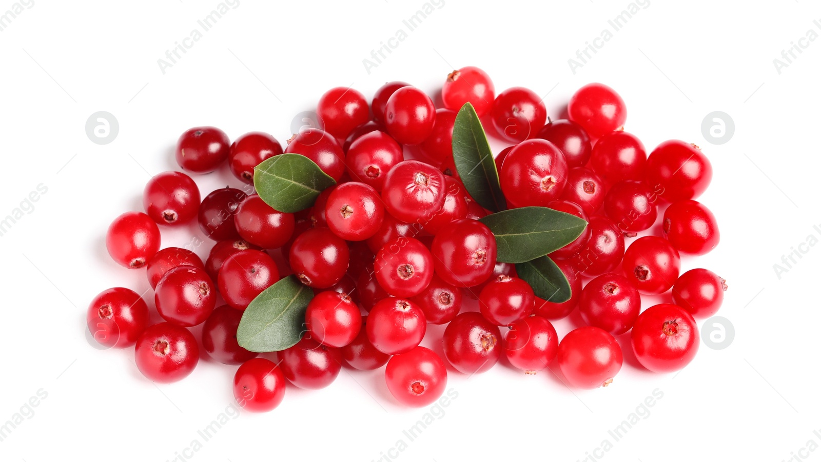 Photo of Pile of fresh cranberries with green leaves on white background, top view