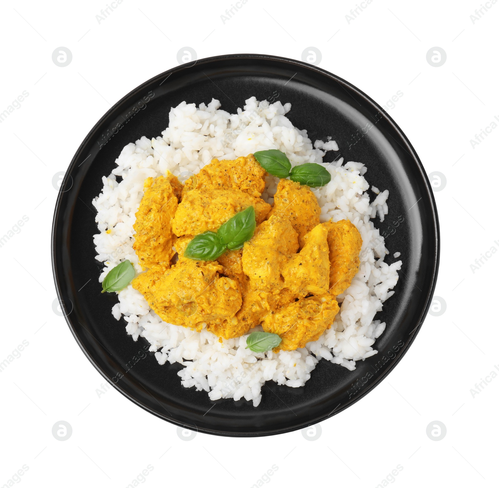 Photo of Delicious rice and chicken with curry sauce isolated on white, top view