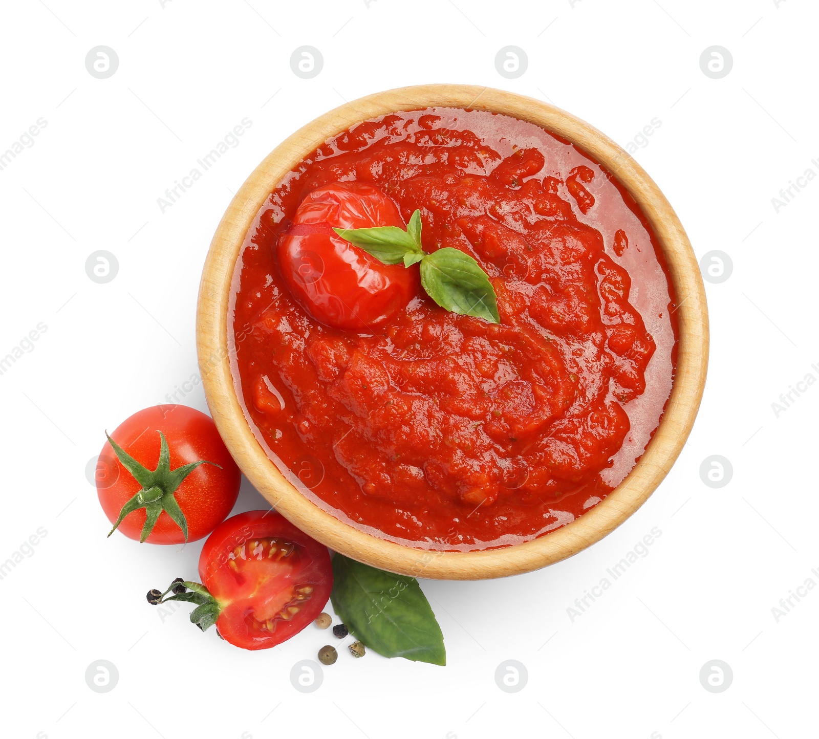 Photo of Homemade tomato sauce in bowl and fresh ingredients isolated on white, top view