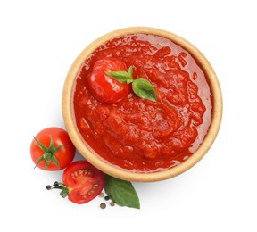 Photo of Homemade tomato sauce in bowl and fresh ingredients isolated on white, top view