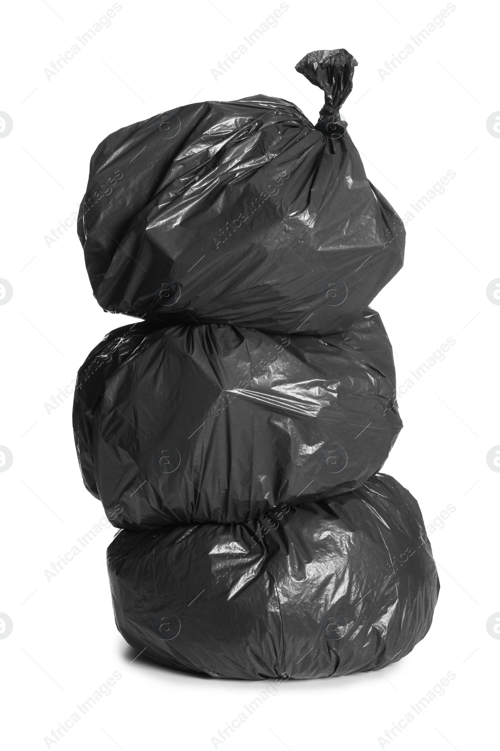 Photo of Black trash bags full of garbage on white background