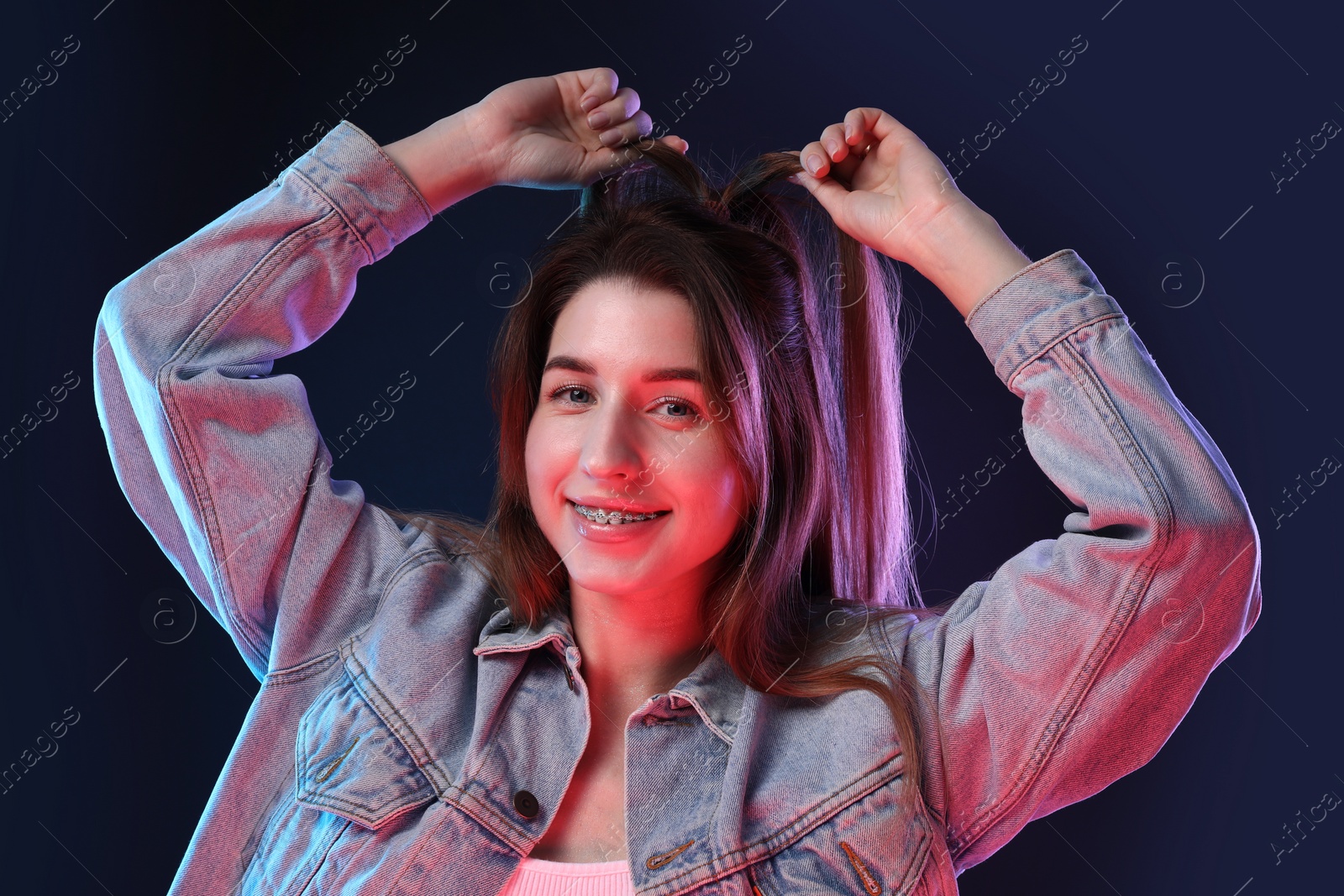 Photo of Portrait of beautiful young woman on color background