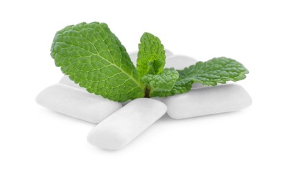 Photo of Heap of chewing gum pieces and mint on white background