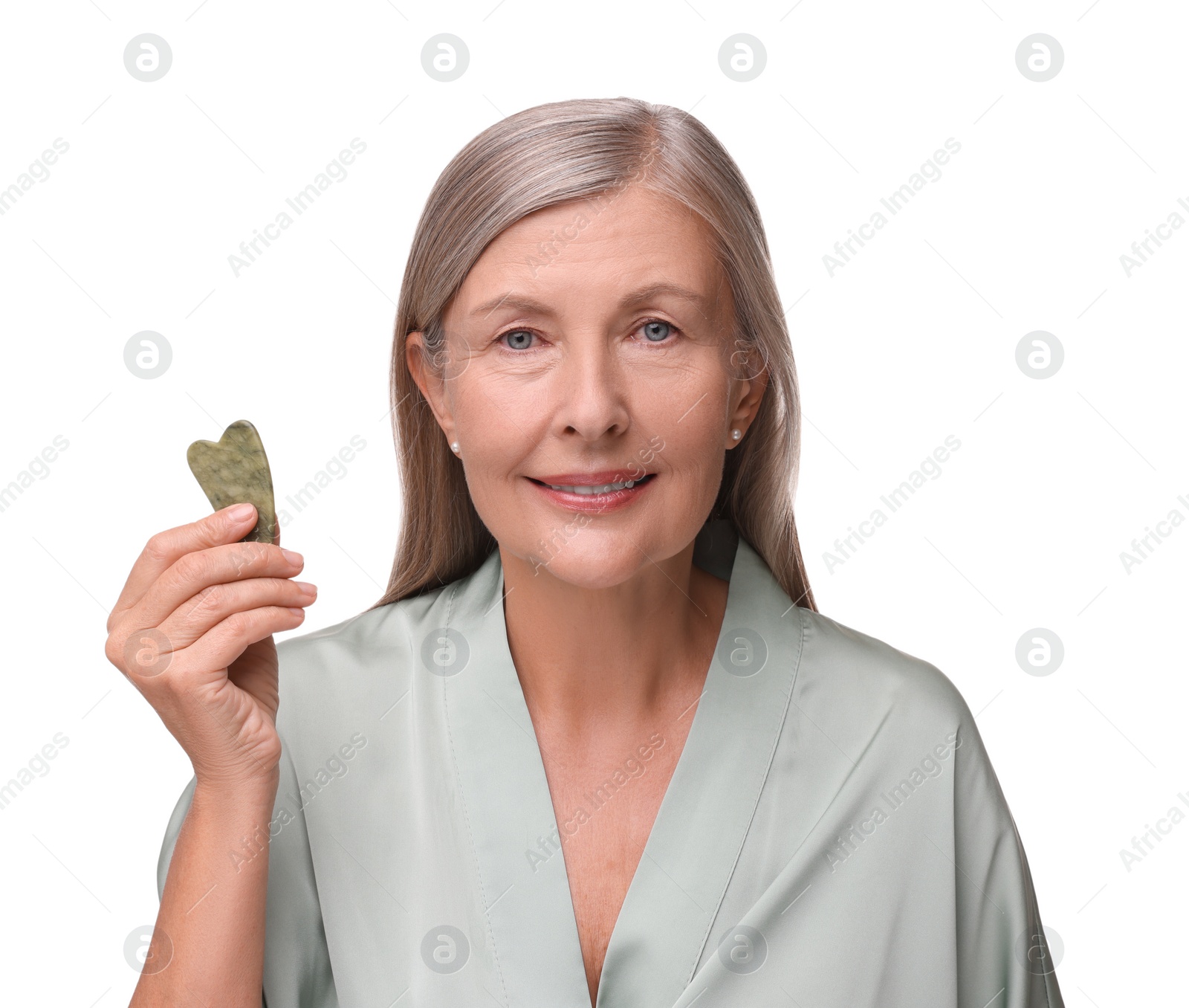 Photo of Woman with jade gua sha tool isolated on white. Facial massage
