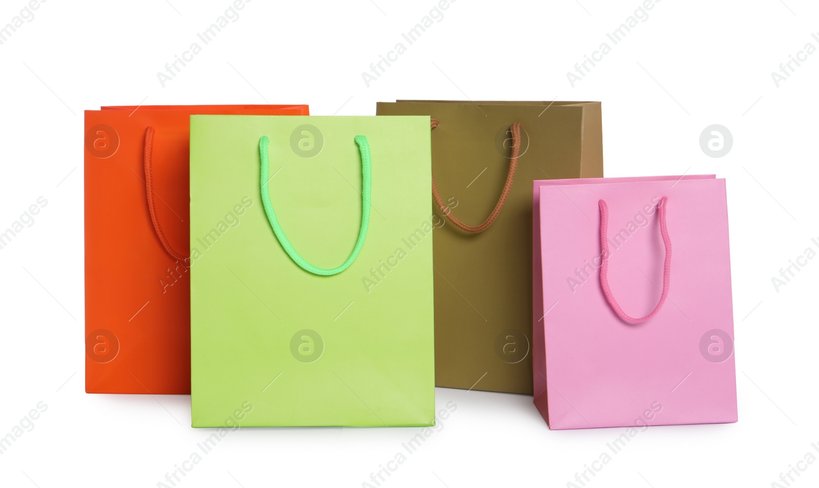 Photo of Colorful paper shopping bags isolated on white