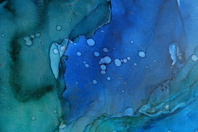 Photo of Abstract liquid ink art painting as background, top view