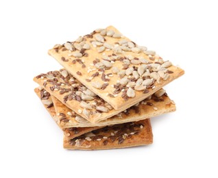 Photo of Stack of cereal crackers with flax, sunflower and sesame seeds isolated on white