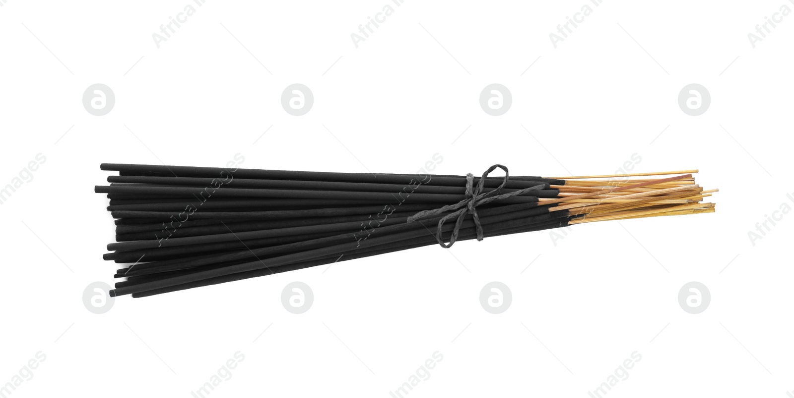 Photo of Many aromatic incense sticks tied with twine on white background