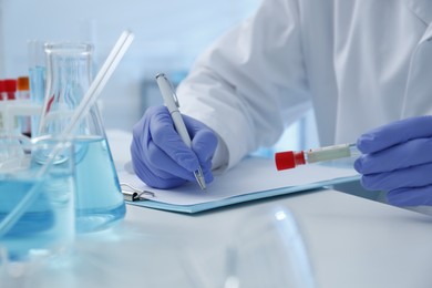 Photo of Scientist working in laboratory, closeup. Medical research