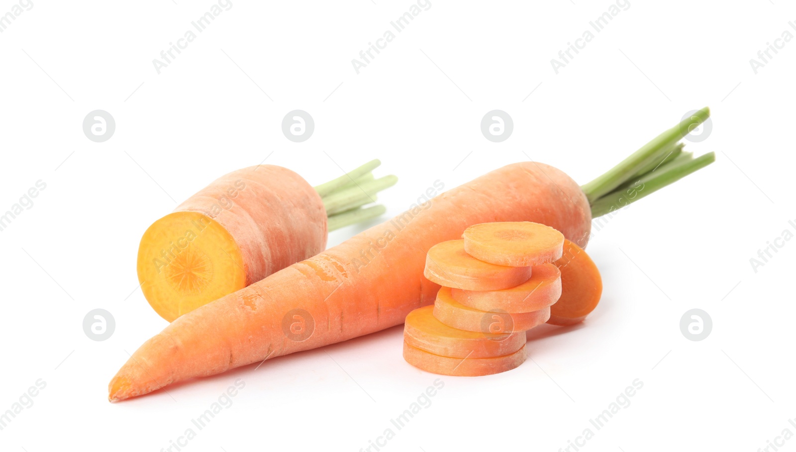 Photo of Whole and cut ripe carrots isolated on white