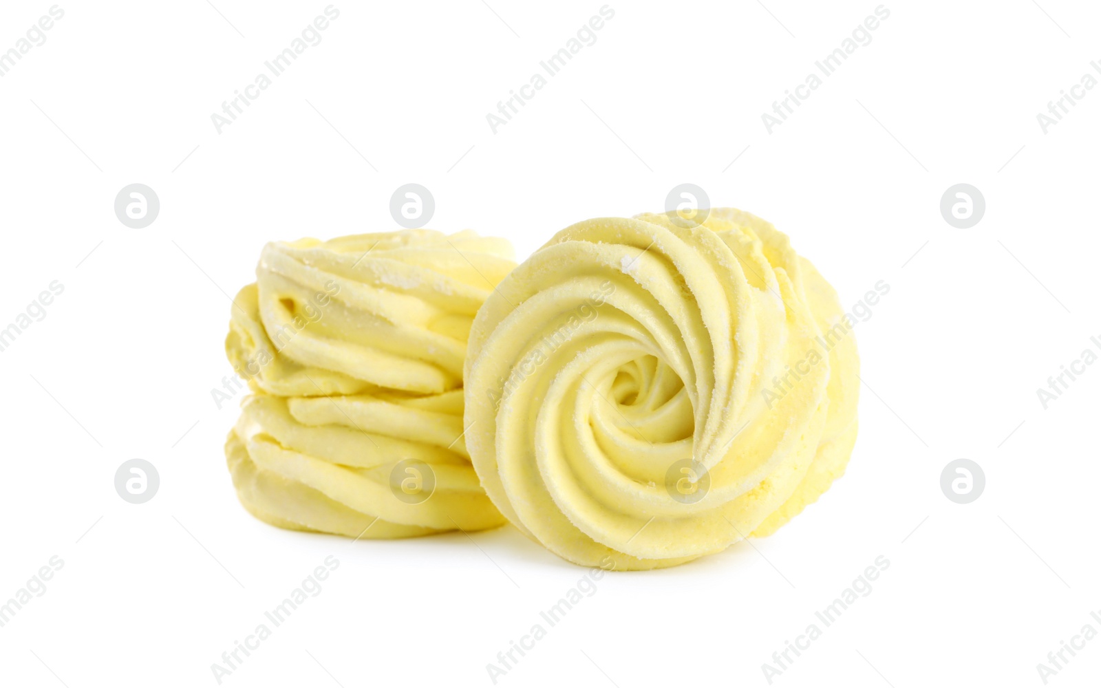 Photo of Two delicious yellow zephyrs on white background