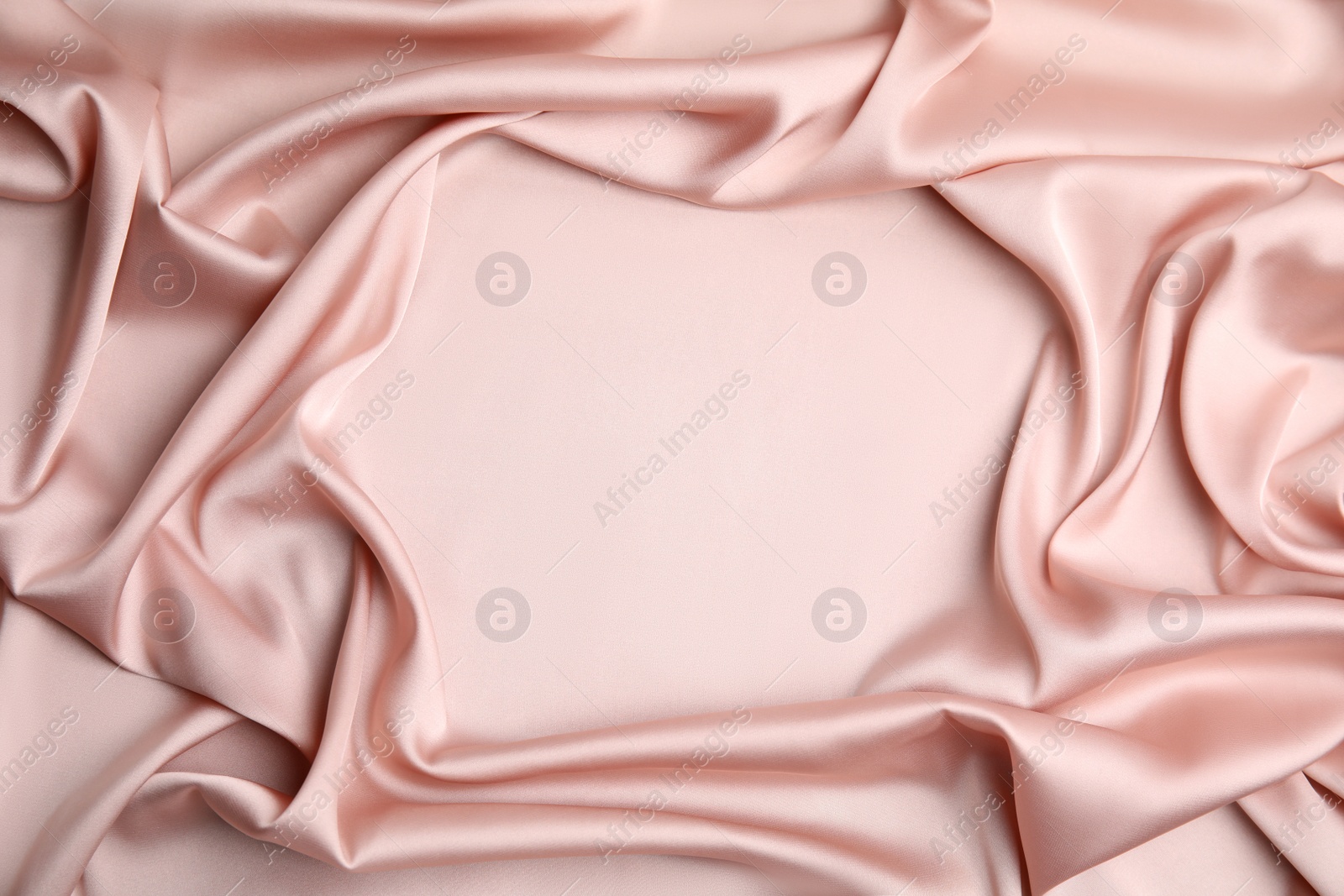 Photo of Texture of delicate pink silk as background, top view