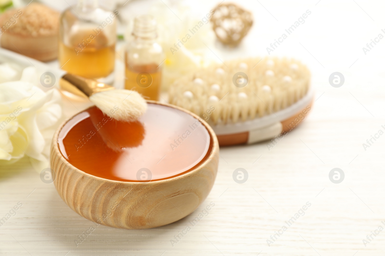 Photo of Composition with cosmetic product for spa body wraps on white wooden background