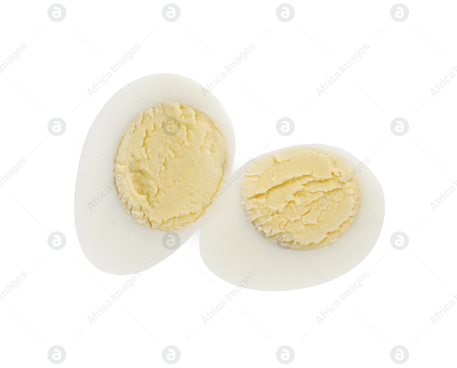 Photo of Halves of peeled hard boiled quail egg on white background, top view