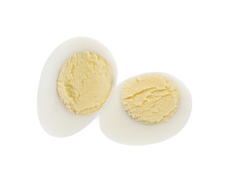 Halves of peeled hard boiled quail egg on white background, top view