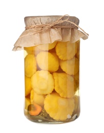 Jar with pickled pattypan squashes on white background