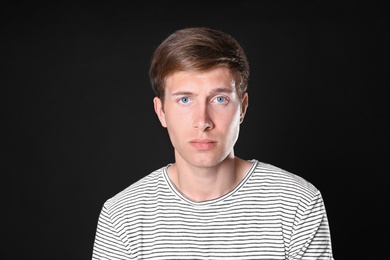 Photo of Portrait of handsome man on black background