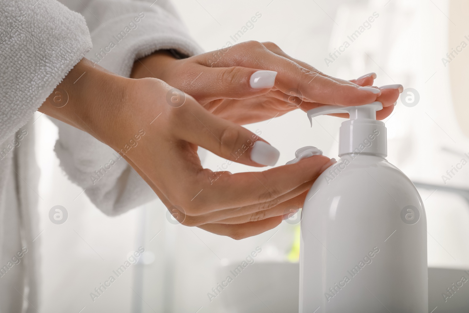 Photo of Teenage girl using gel in bathroom, closeup. Skin care cosmetic