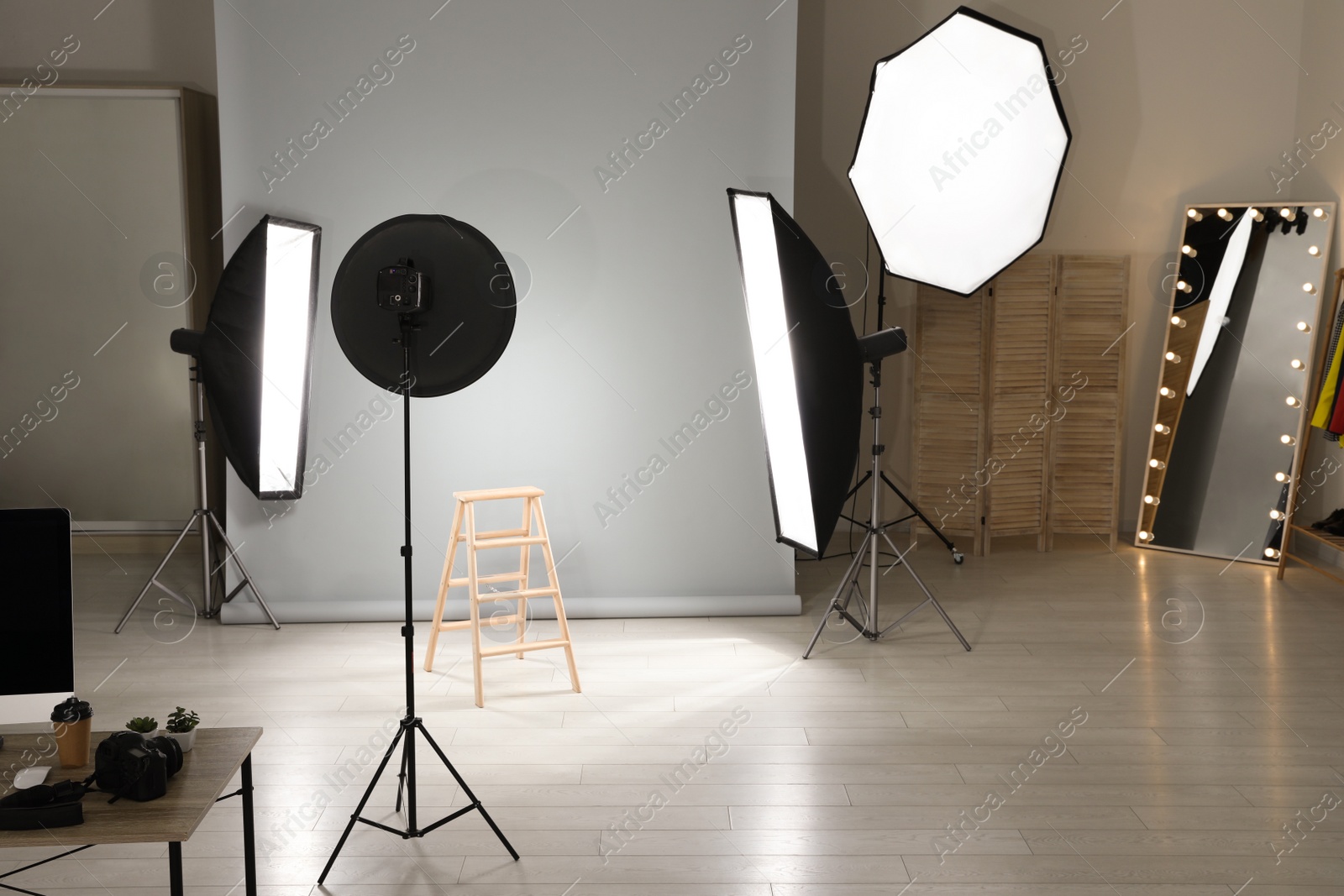 Photo of Interior of modern photo studio with professional equipment