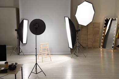 Interior of modern photo studio with professional equipment