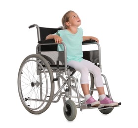 Little girl in wheelchair on white background