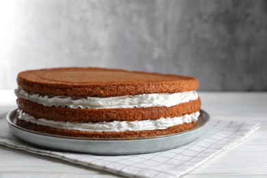 Photo of Delicious homemade layer cake on white wooden table, closeup