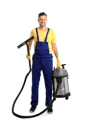 Male janitor with carpet cleaner on white background