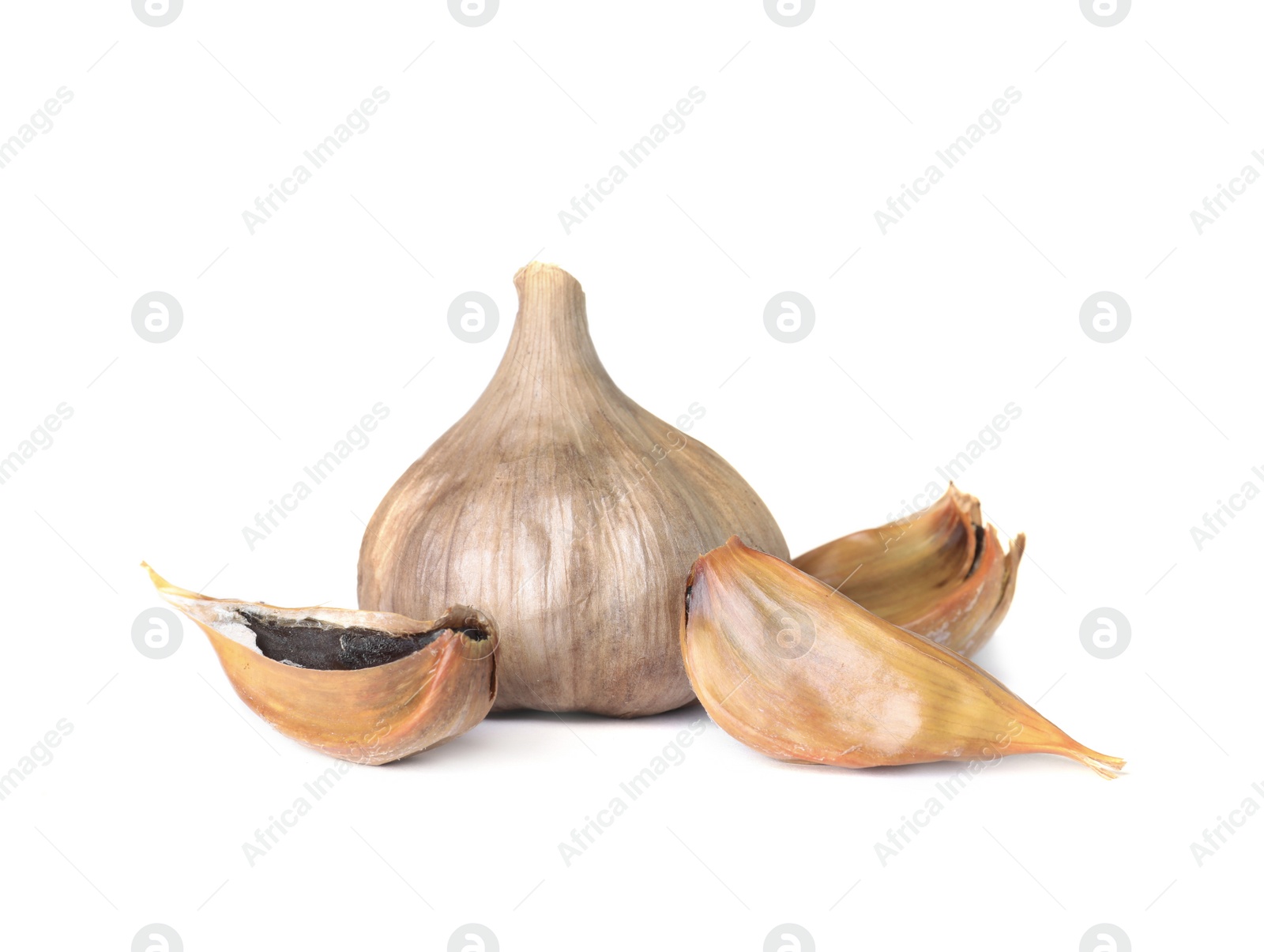 Photo of Aged black garlic on white background. Asian cuisine