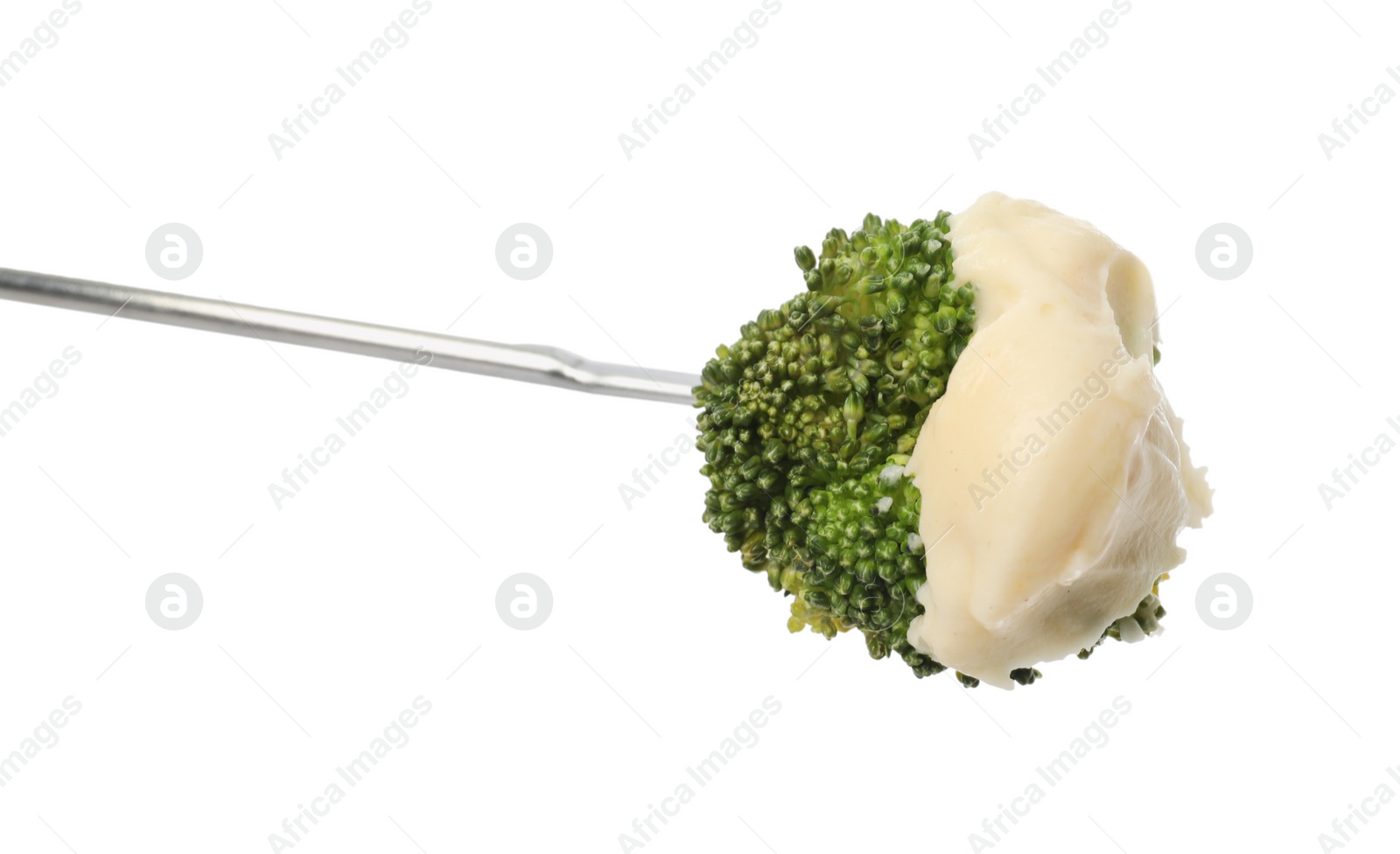 Photo of Tasty fondue. Fork with broccoli and melted cheese isolated on white