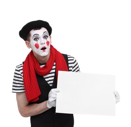 Photo of Mime artist with blank sign making shocked face on white background