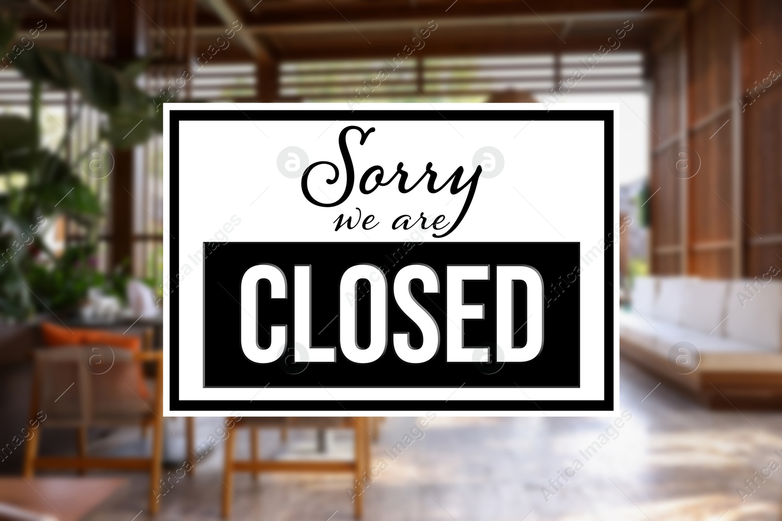 Image of Sorry we are closed sign against blurred background