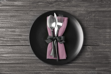 Photo of Beautiful table setting on dark wooden background, top view