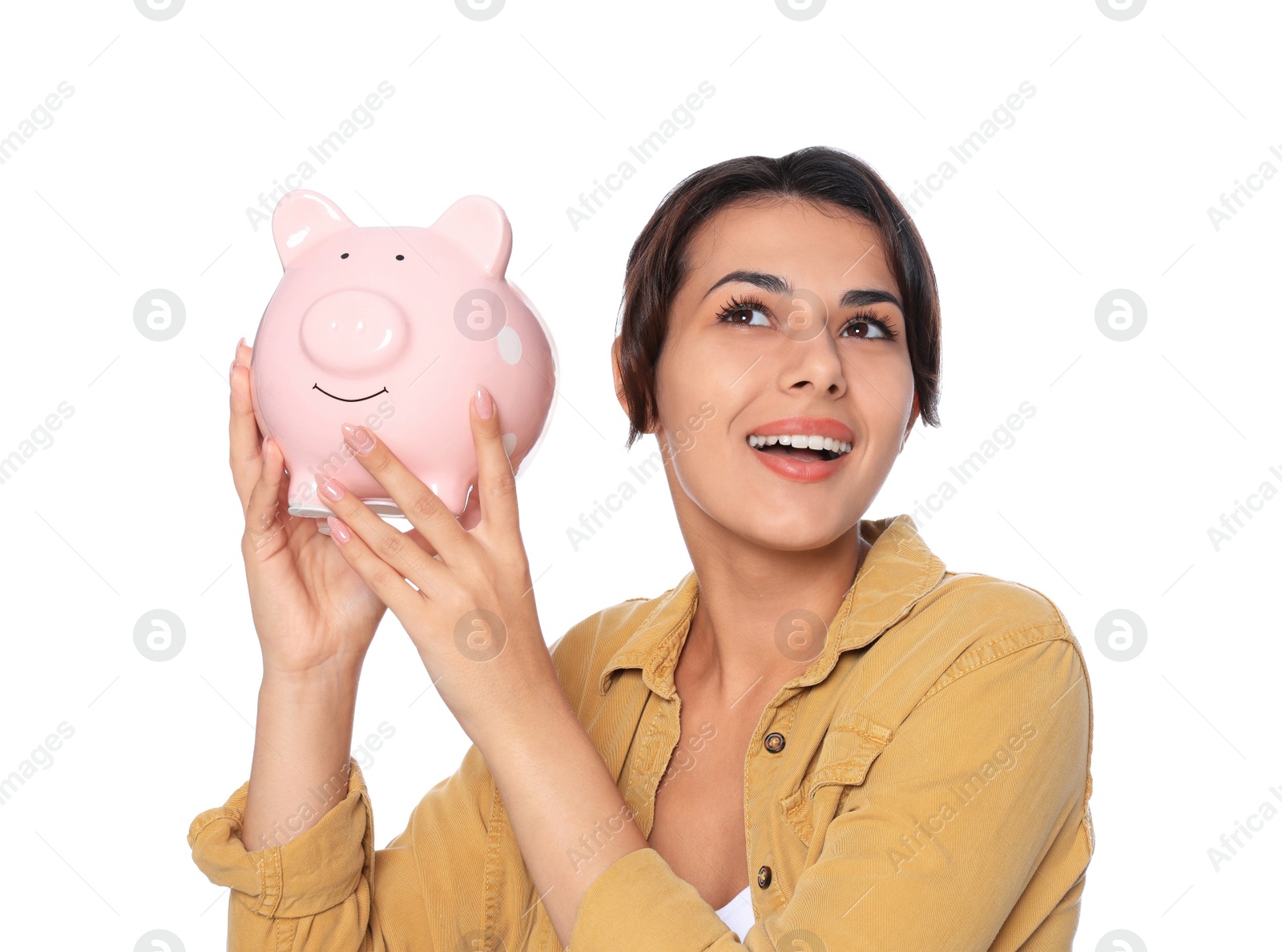 Photo of Young woman with piggy bank on white background