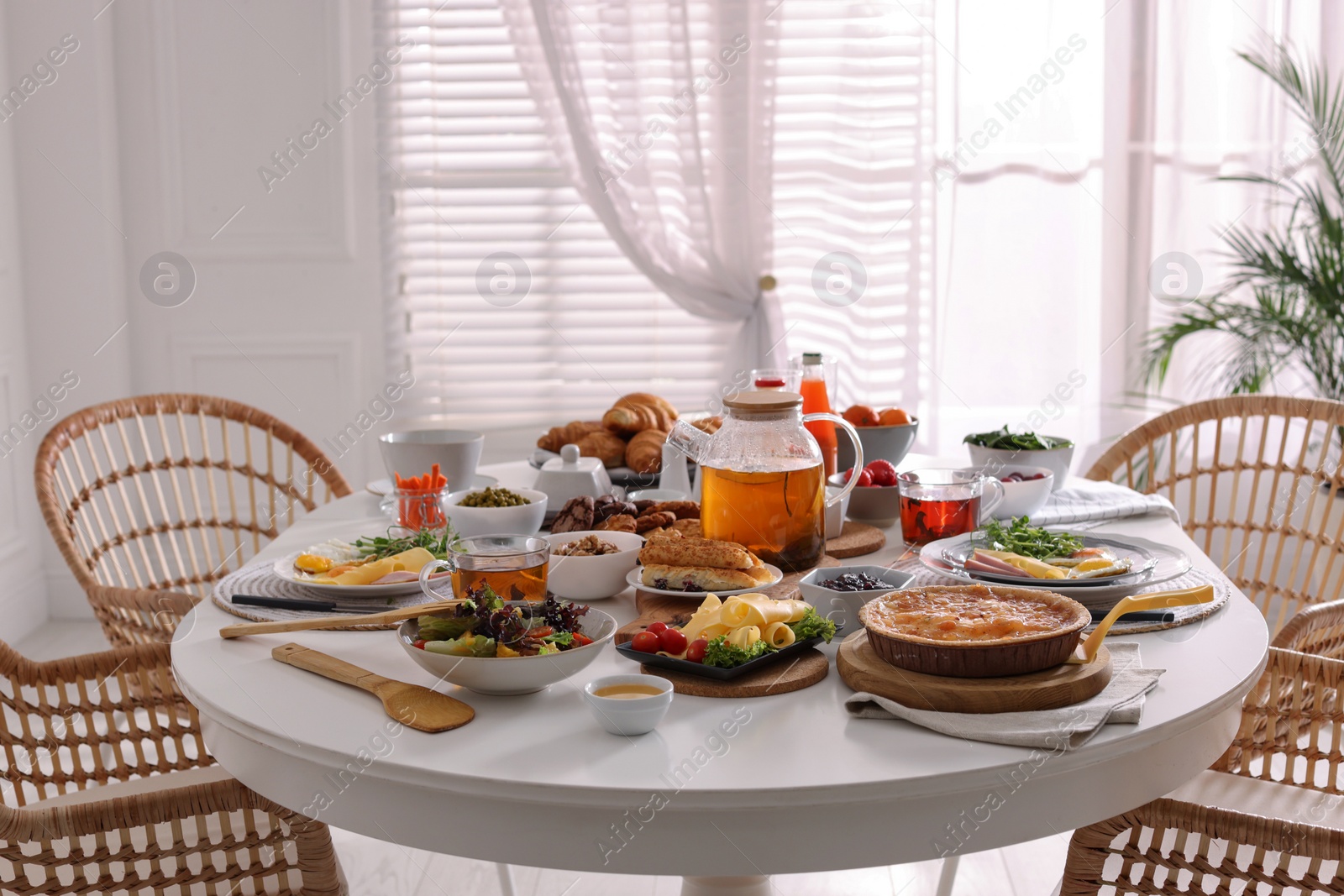 Photo of Many different dishes served on buffet table for brunch