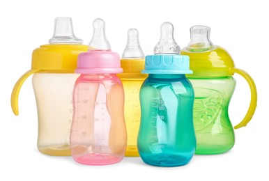 Many empty feeding bottles for infant formula on white background