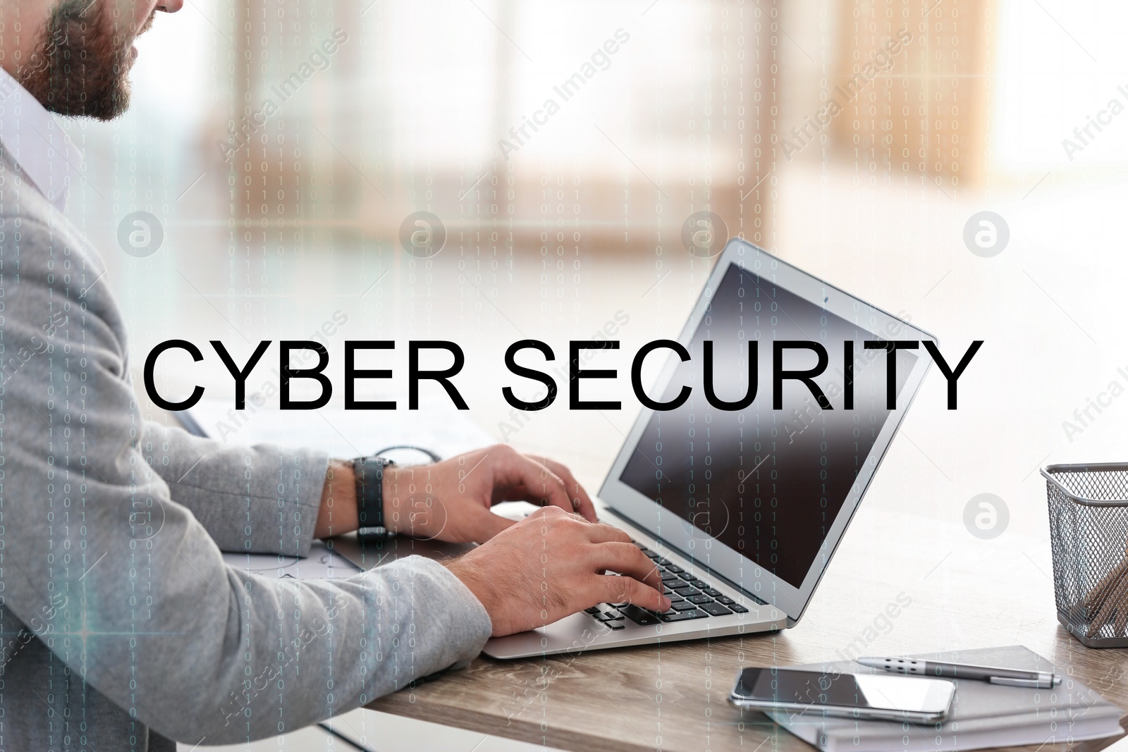 Image of Cyber security concept. Man working with laptop at table indoors, closeup