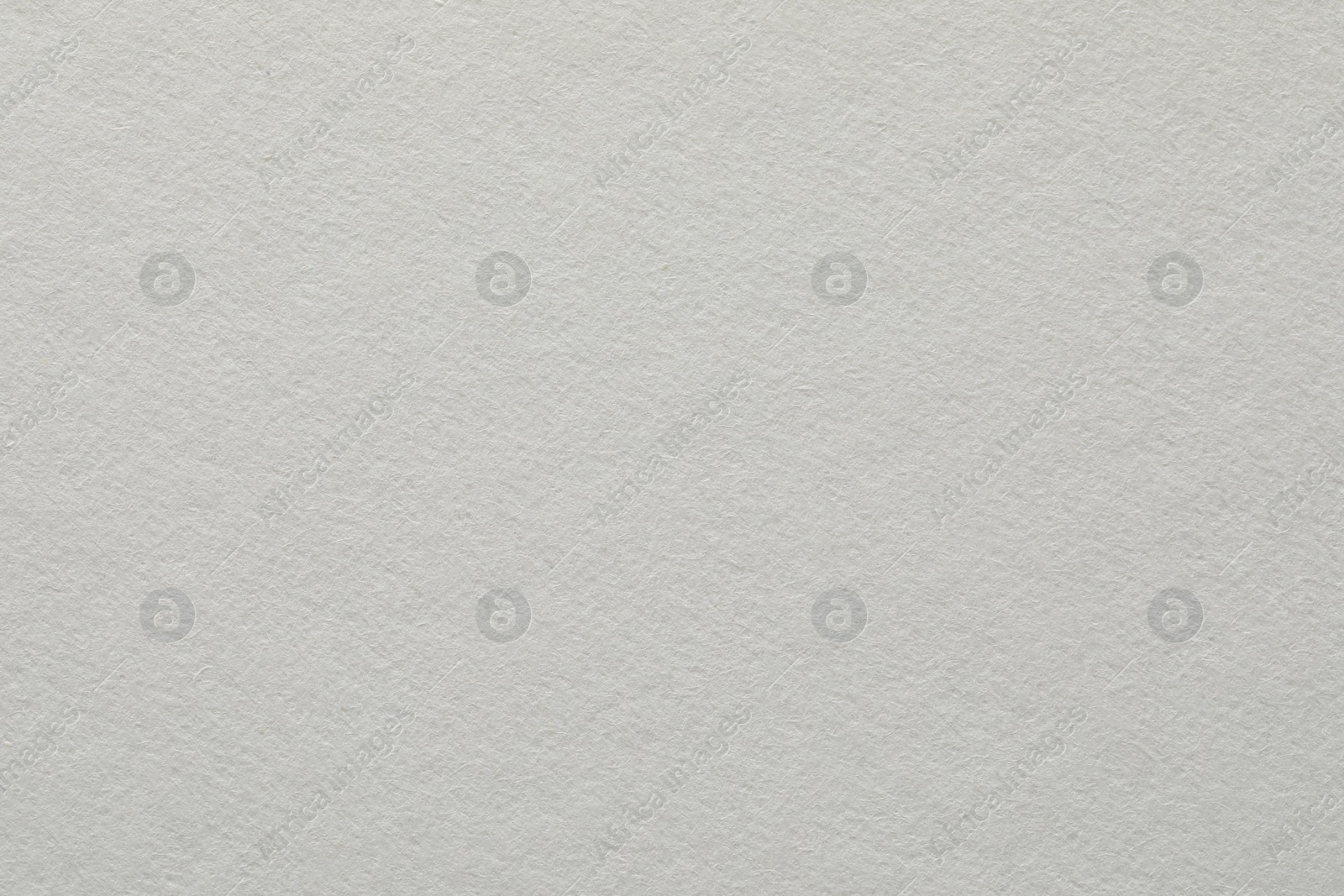 Photo of Texture of white paper sheet as background, closeup