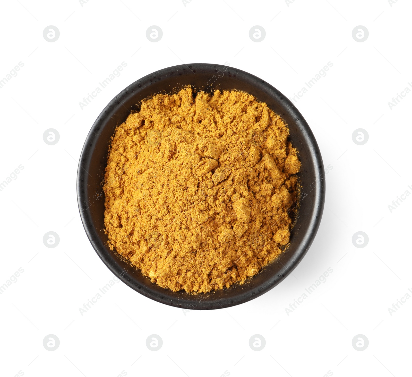Photo of Dry curry powder in bowl isolated on white, top view