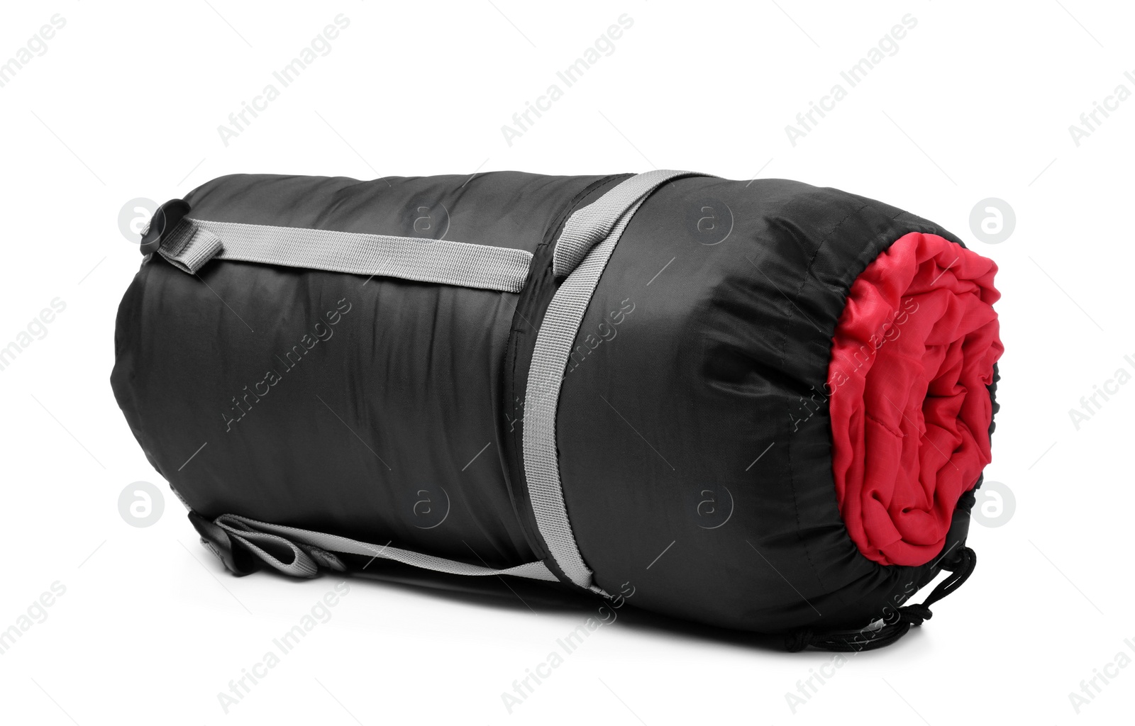 Photo of Sleeping bag in case isolated on white. Tourist equipment