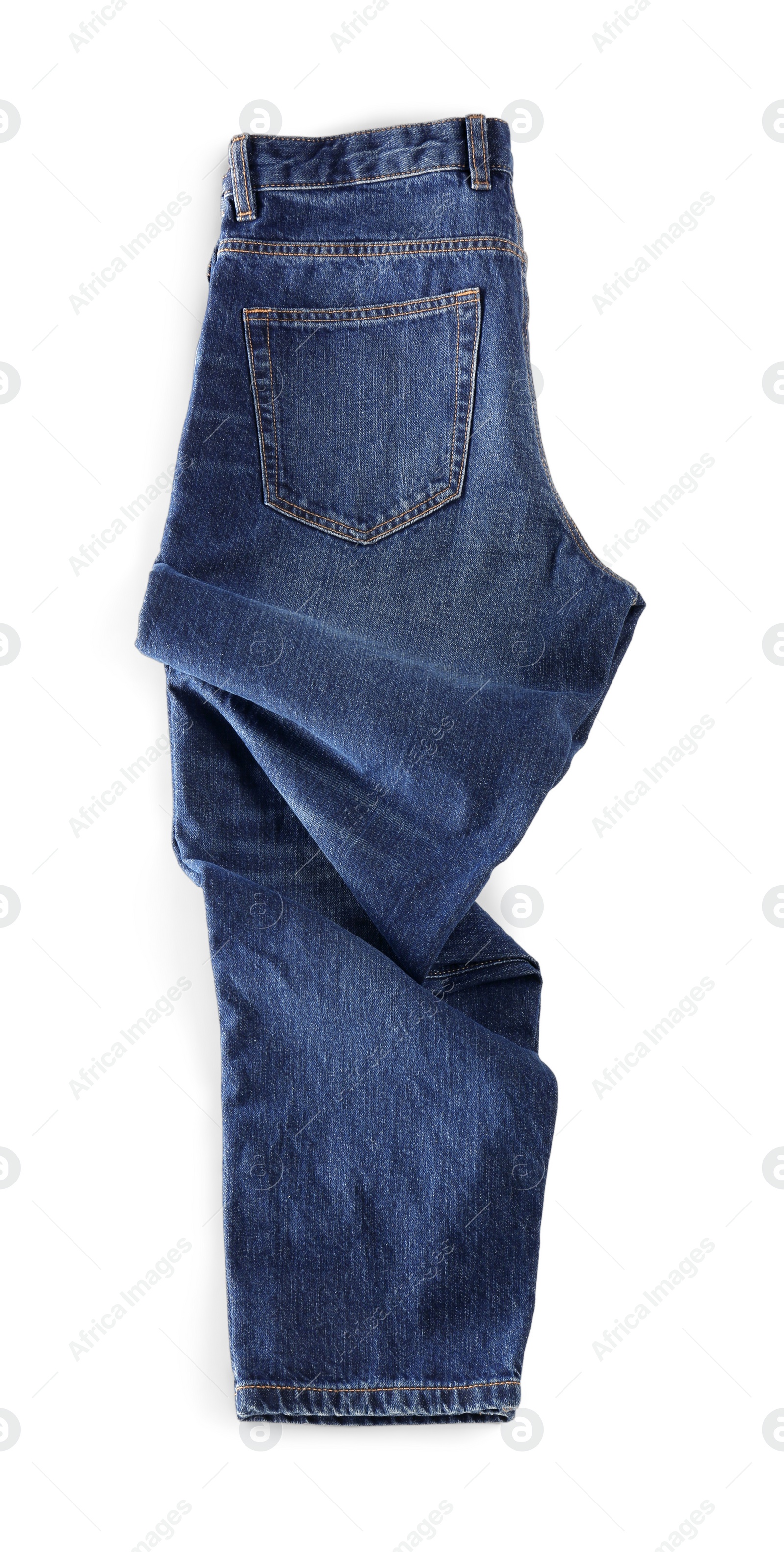 Photo of Stylish dark blue jeans isolated on white, top view