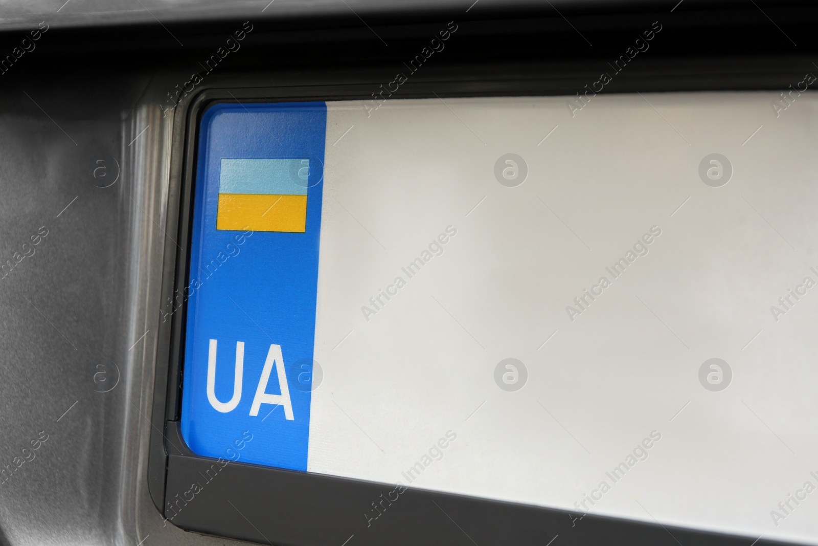 Photo of Car with vehicle registration plate, closeup view