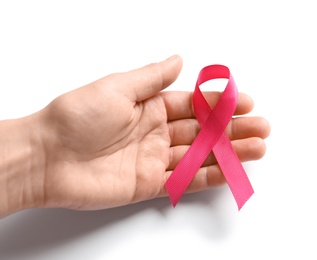 Photo of Woman holding pink ribbon on white background, top view. Cancer awareness