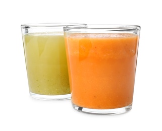 Photo of Glasses of delicious fresh juices on white background