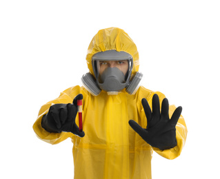 Man wearing chemical protective suit holding test tube with blood sample on white background. Prevention of virus spread