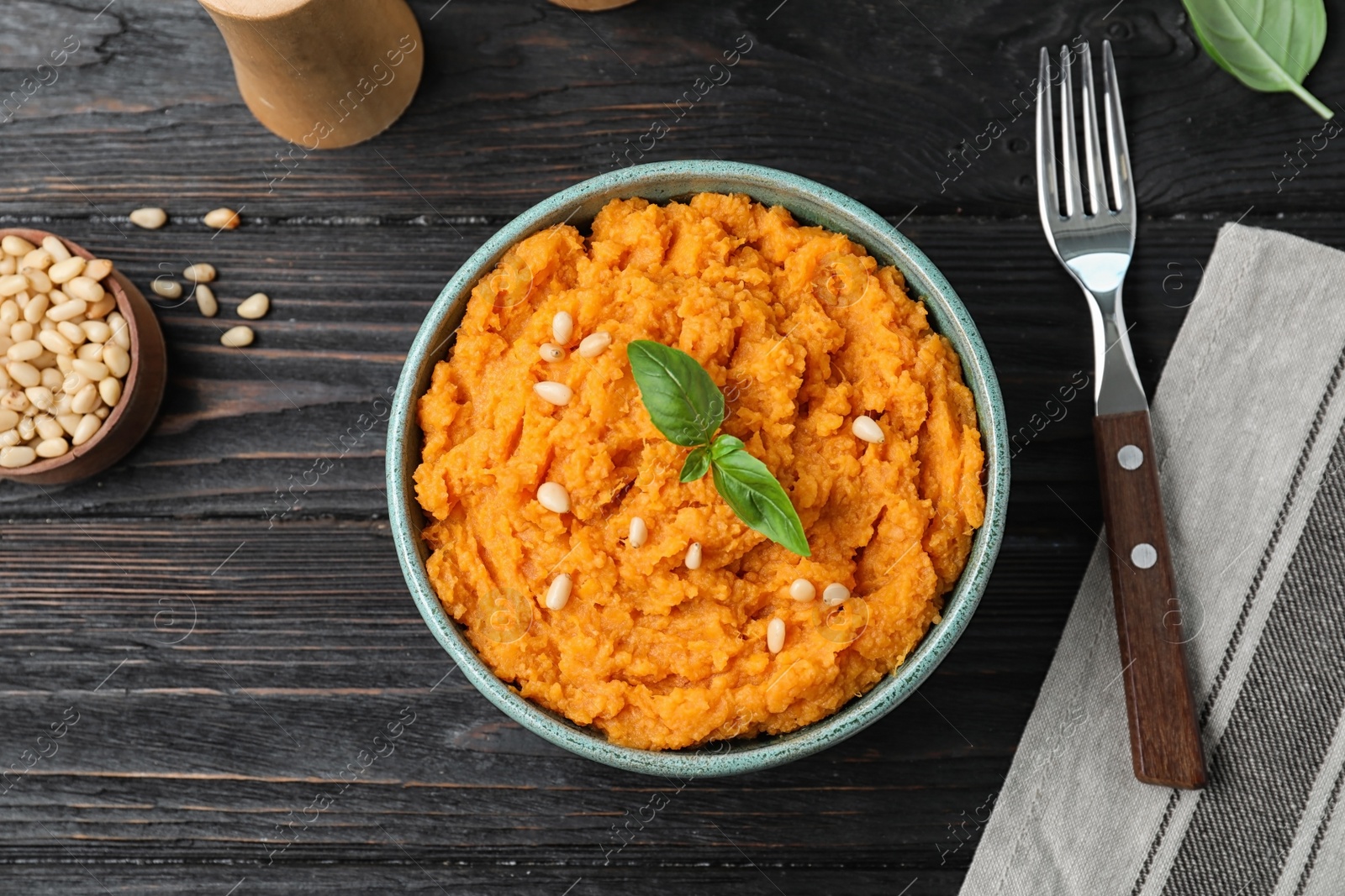 Photo of Flat lay composition with mashed sweet potatoes on wooden background