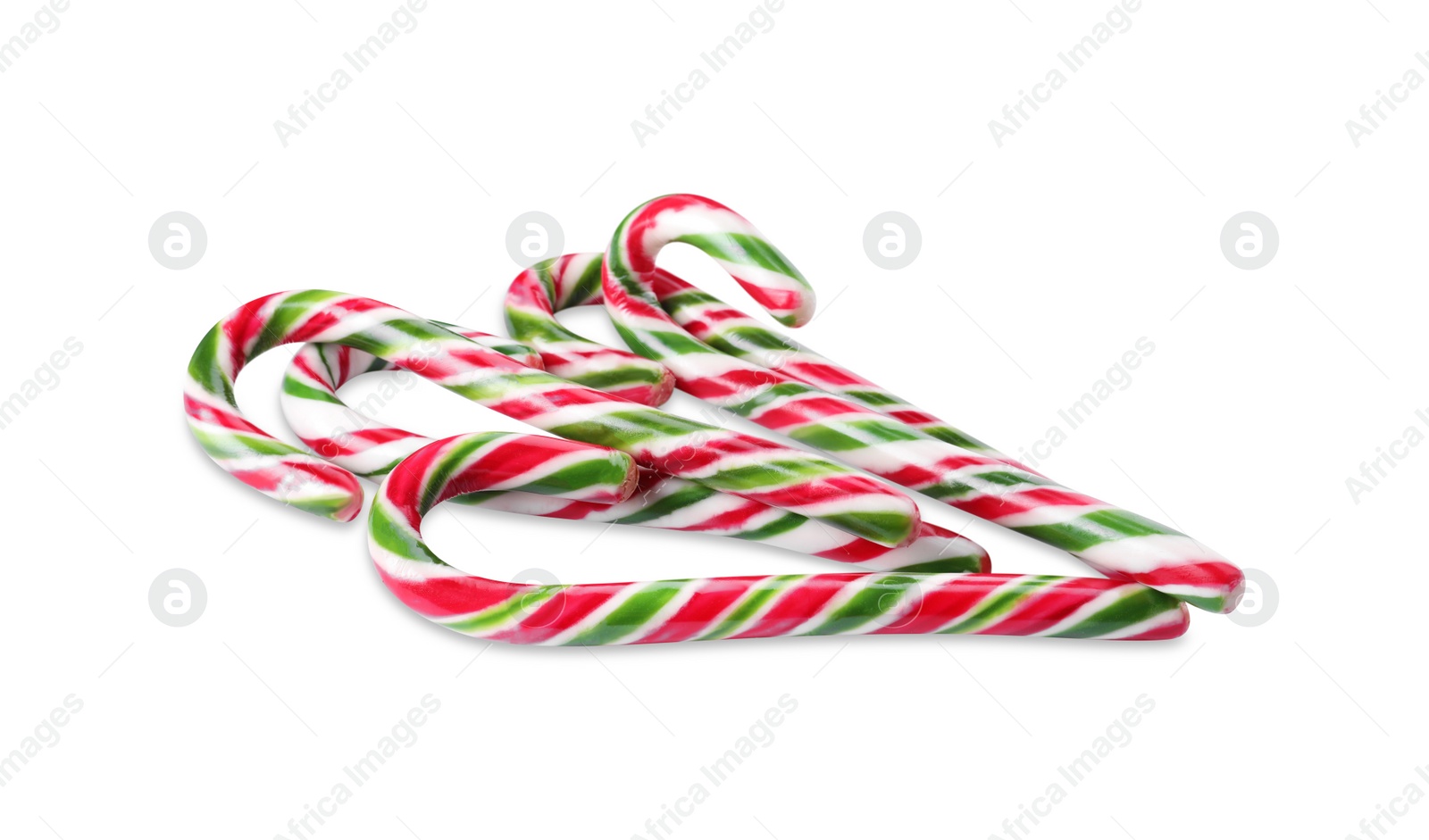 Photo of Sweet Christmas candy canes on white background