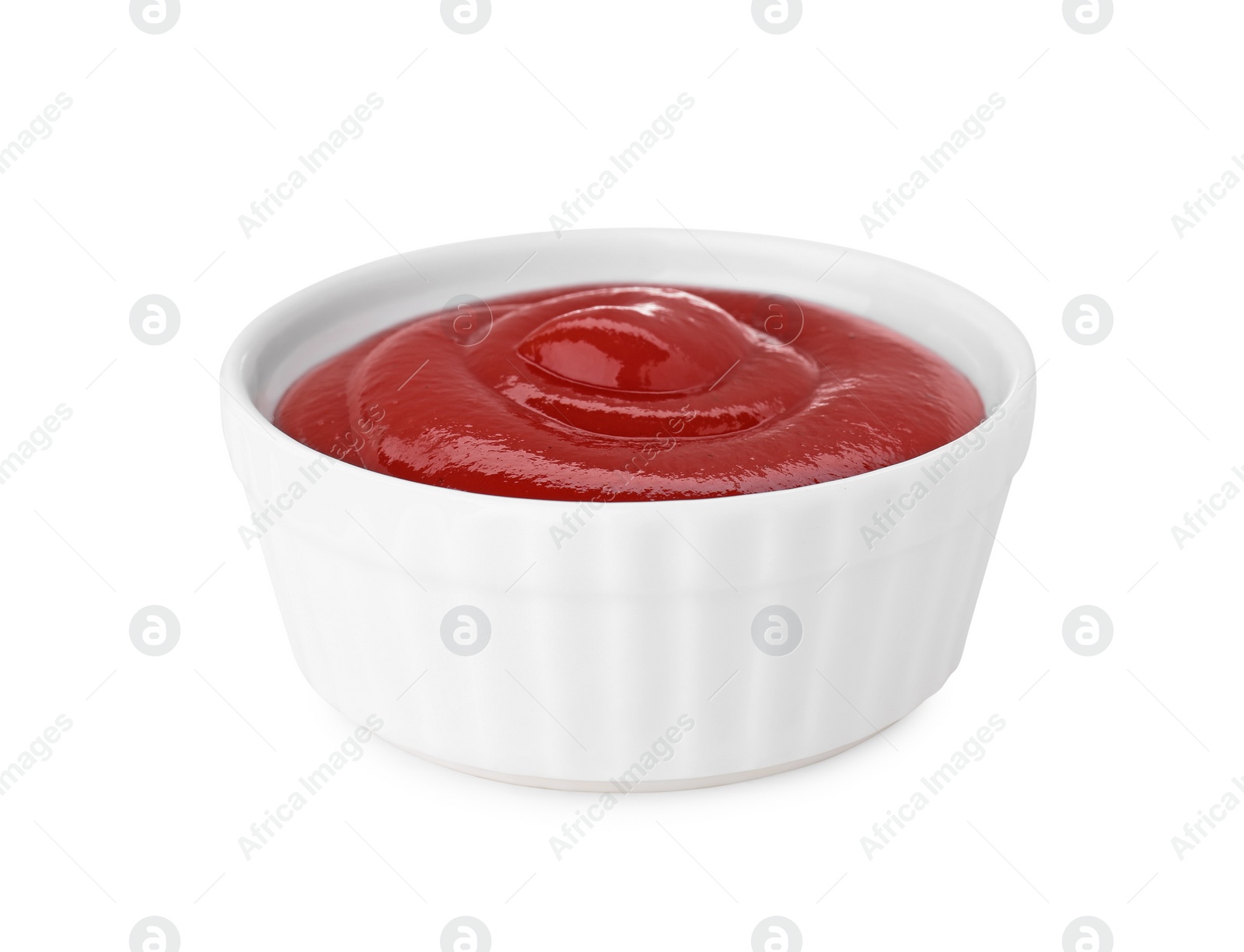 Bowl of tasty ketchup isolated on white. Tomato sauce Photo of Bowl of tasty ketchup isolated on white. Tomato sauce