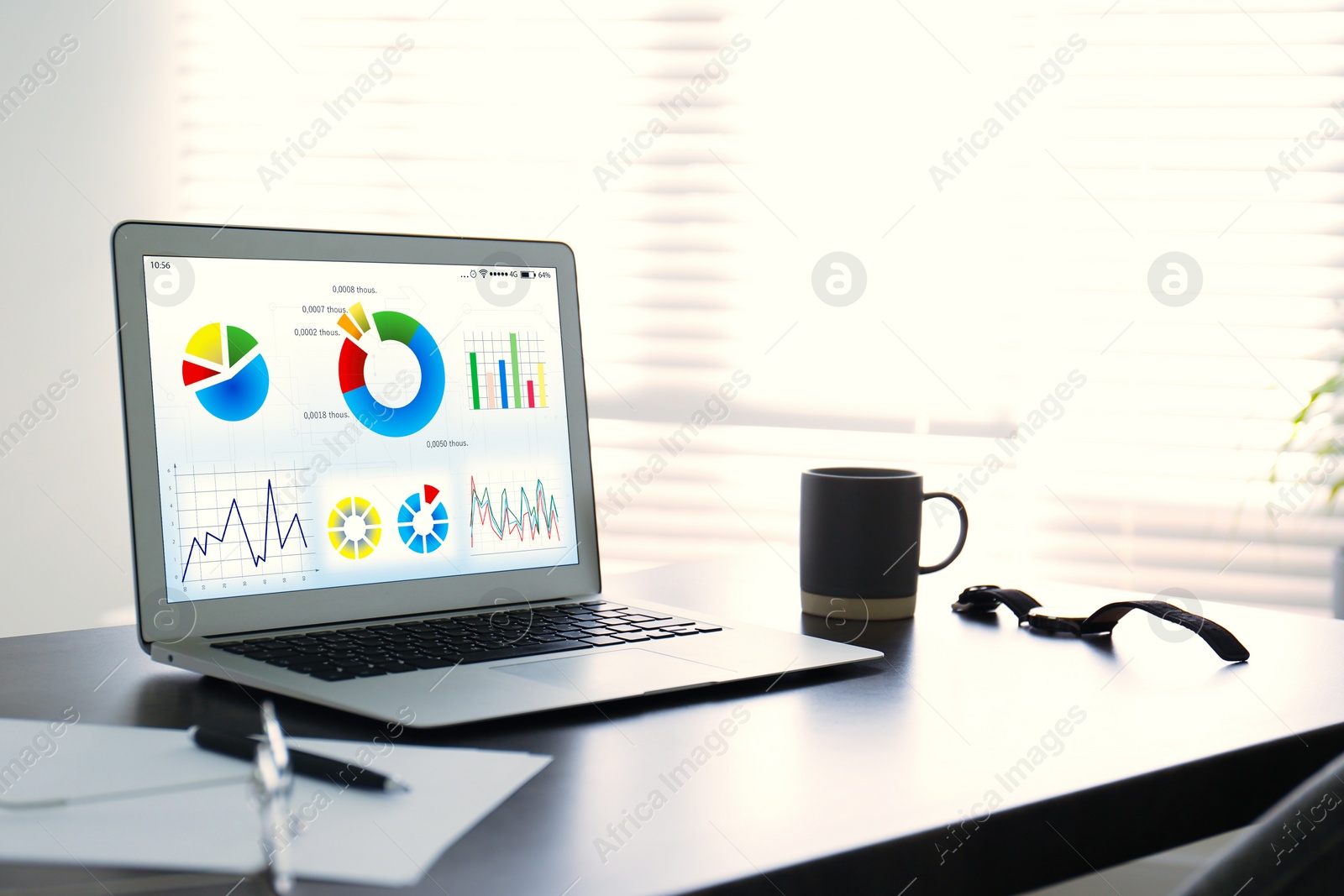 Image of Modern laptop on office table. Business analytics