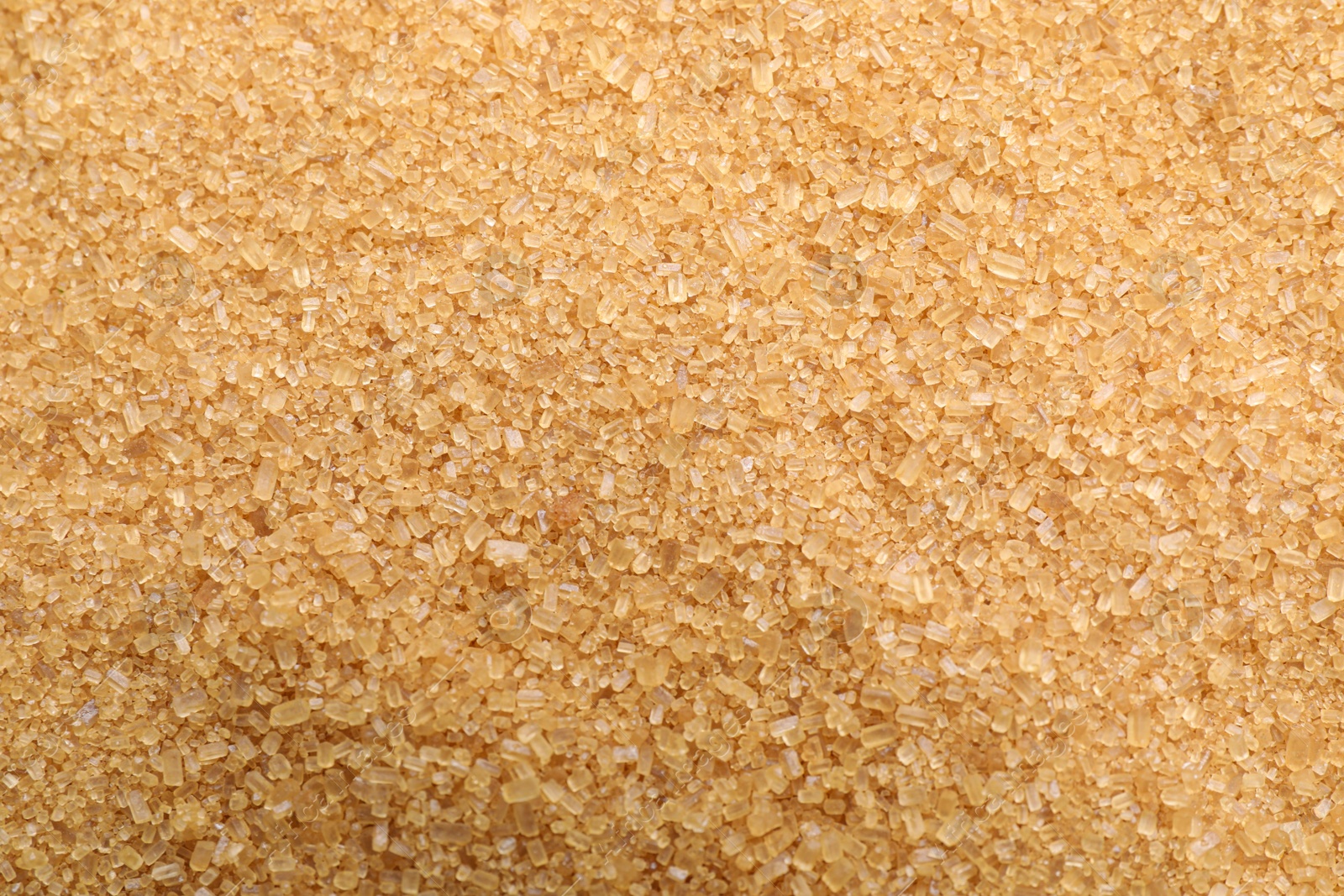 Photo of Pile of brown sugar as background, closeup