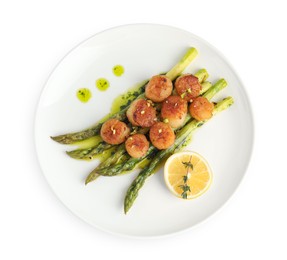 Photo of Delicious fried scallops with asparagus, lemon and thyme isolated on white, top view